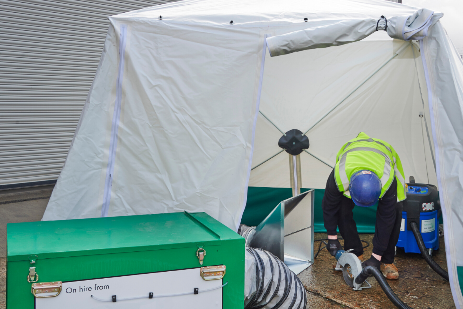 Dustex Pop Up Tent and extraction being used together for floor slab cutting