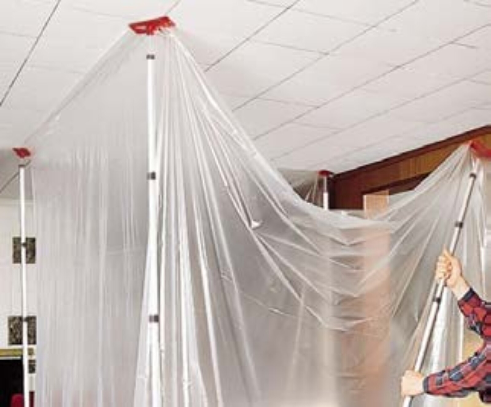 Dustex Quick Props example image with worker using them to put dust sheets in place