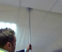 Dustex Quick Props in use to place dust sheets on a project