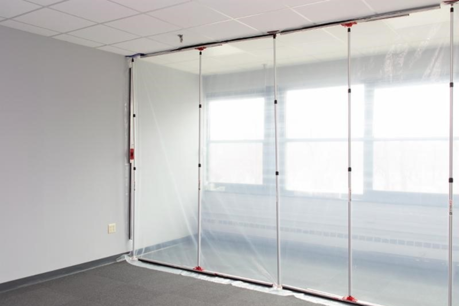 Dustex Quick-Props used to create a temporary dust sheet wall for work taking place inside a building