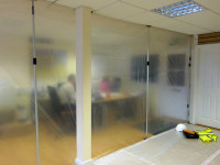 Dustex Quick props used to create a dust sheet barrier between a live office environment and adjacent work area