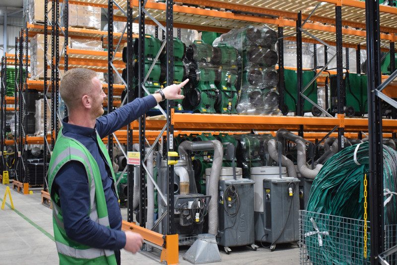 Header image - RVT operative inside a large warehouse full of temporary hazard control hire solutions 1