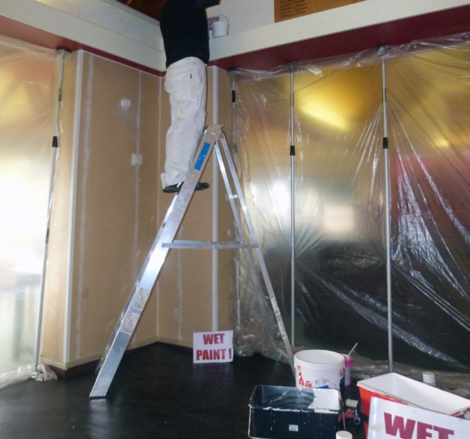 Inside a wet trades work area where Dustex Quick props have been used to hold dust sheets in place