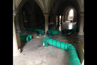 4 VENTEX® Axial 300P Fans directing air to two rows of ducting on the floor of a water storage tank